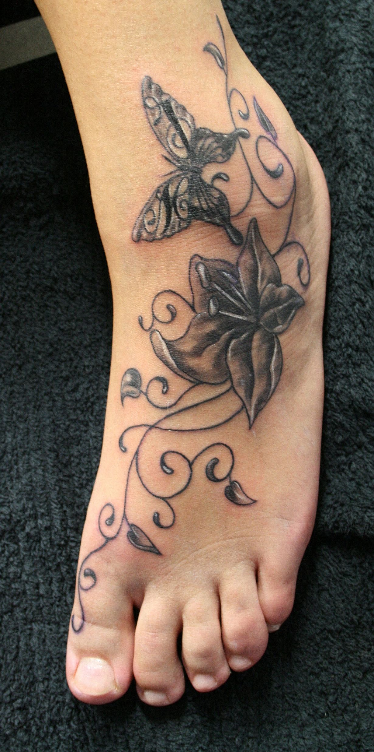 Butterfly Ankle Tattoos title=
