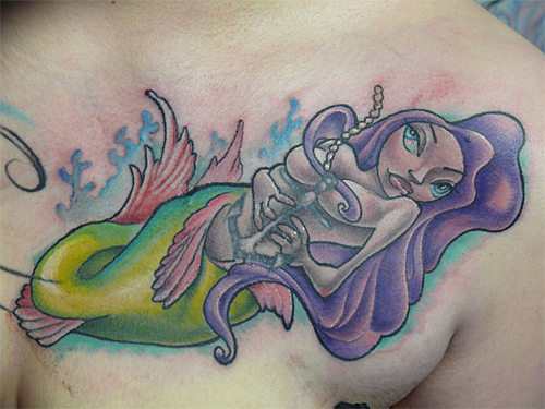 mermaid on crest - chest tattoo