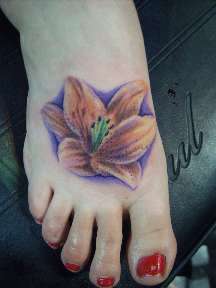 Flower tattoo on foot by