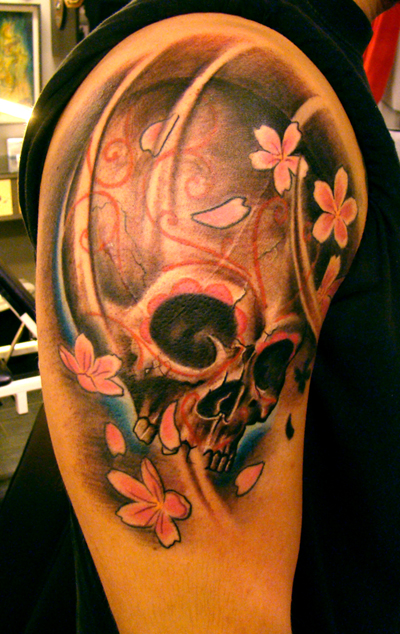tattoos of skulls and flowers. tattoos of skulls and flowers.