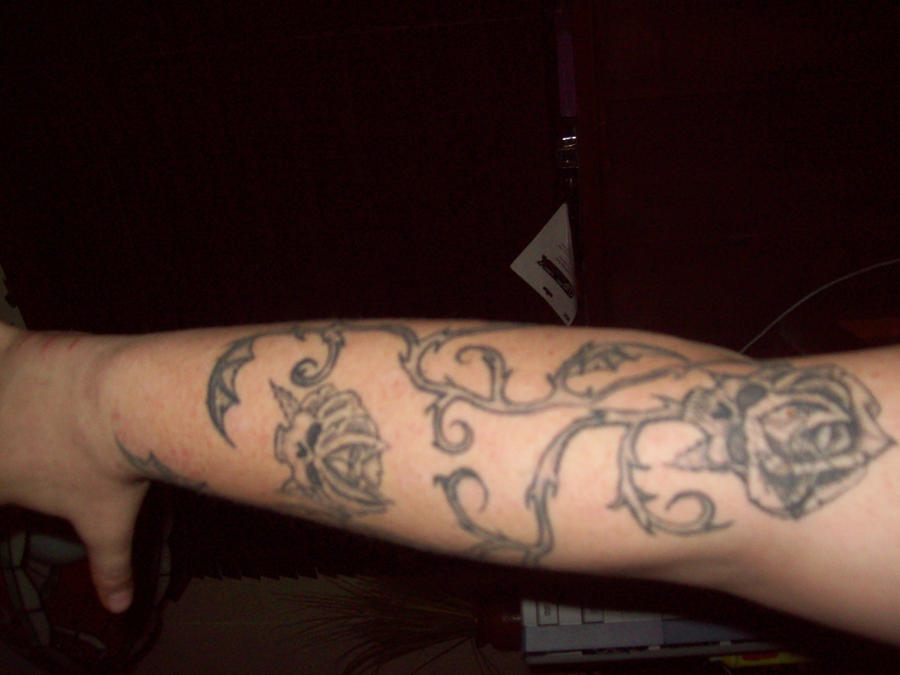 skull wings tattoos. wing tattoos skull flowers and